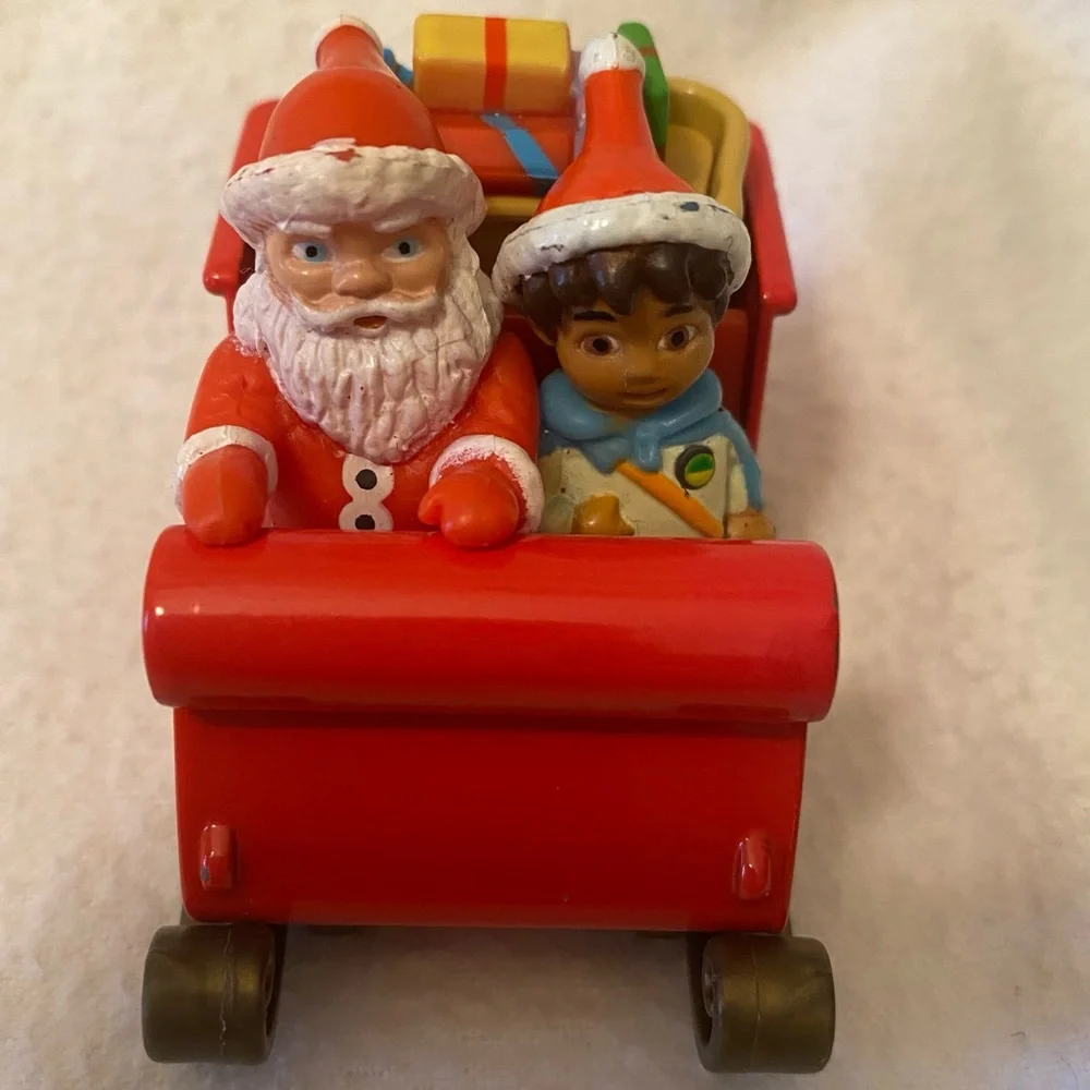 Go Diego and Dora holiday ornament characters with boots, swiped and Santa too!